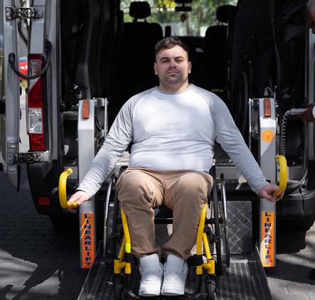 Caregiver assisting elderly man smiling